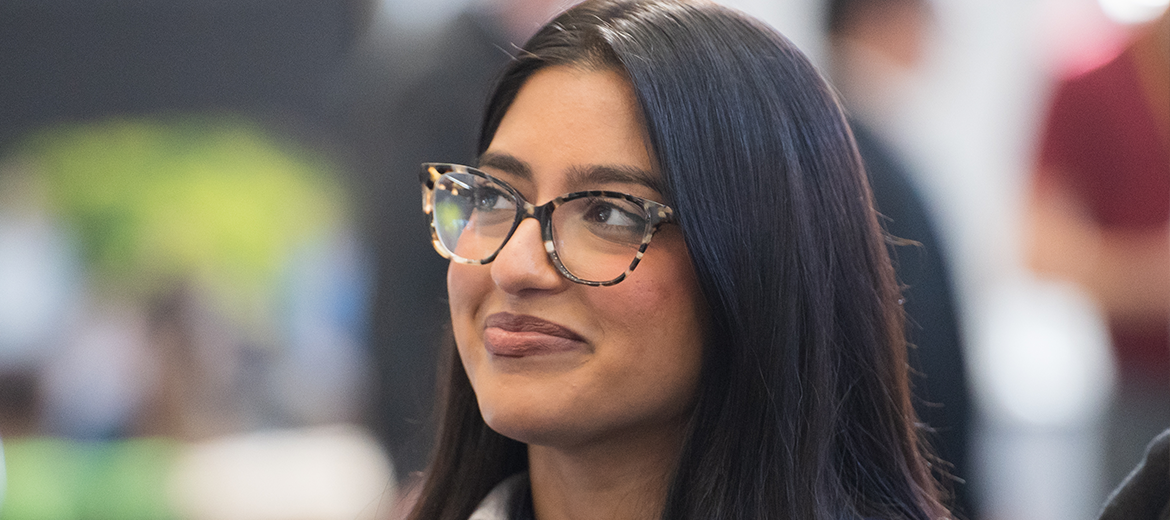 Woman looking off into the distance at an event